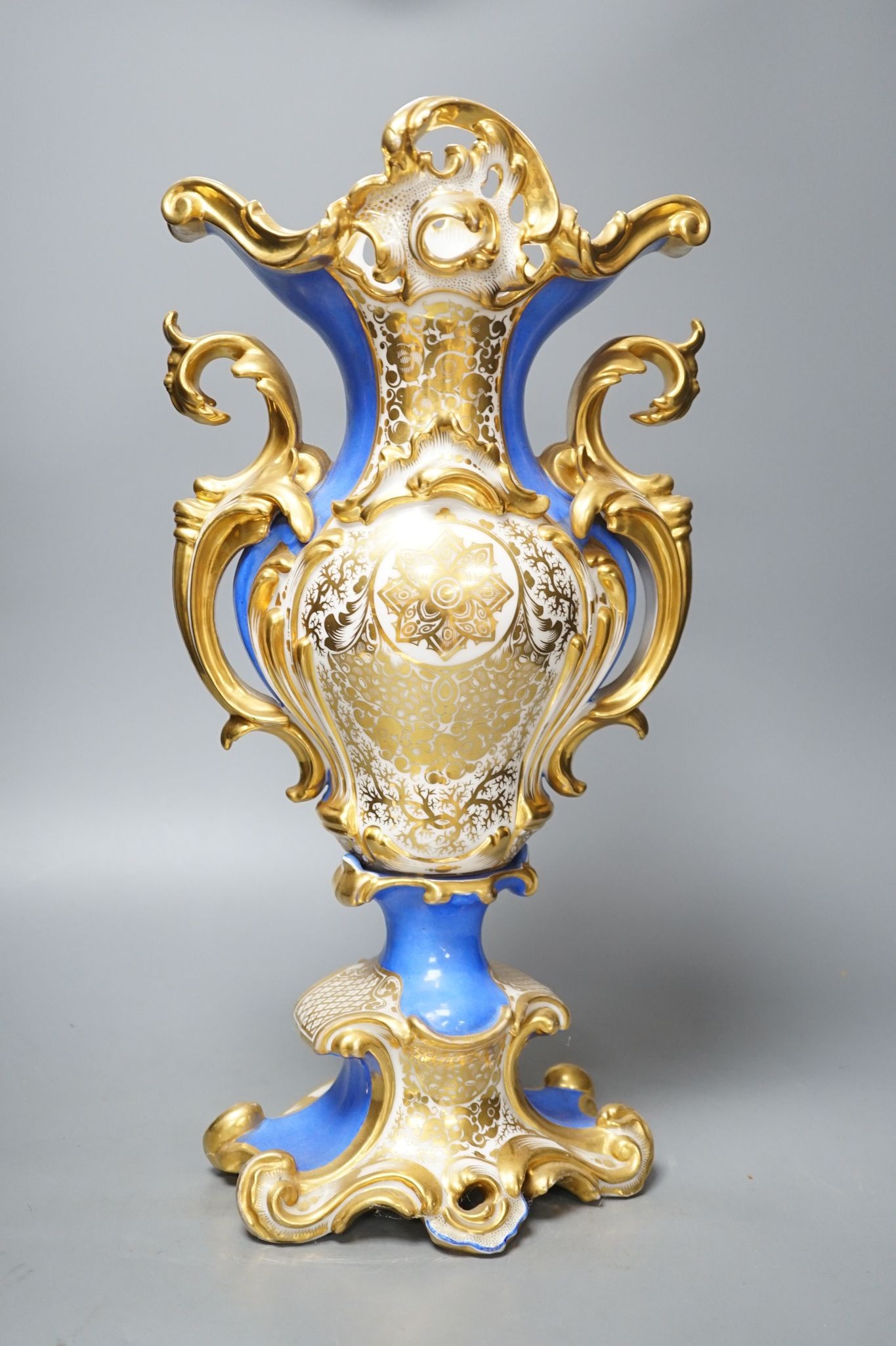 An early 19th century Paris porcelain vase in Feuillet style painted with a folly 44cm